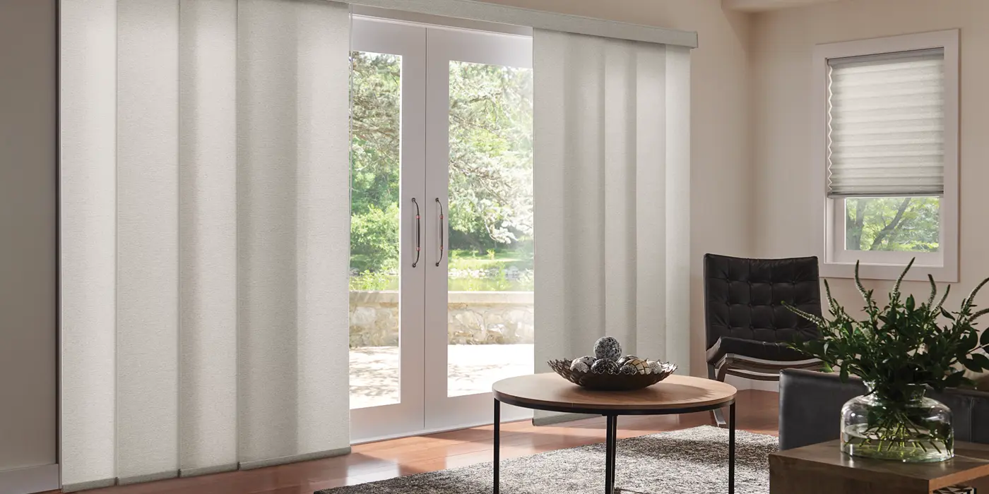 vertical shades covering large sliding glass doors in a modern living room